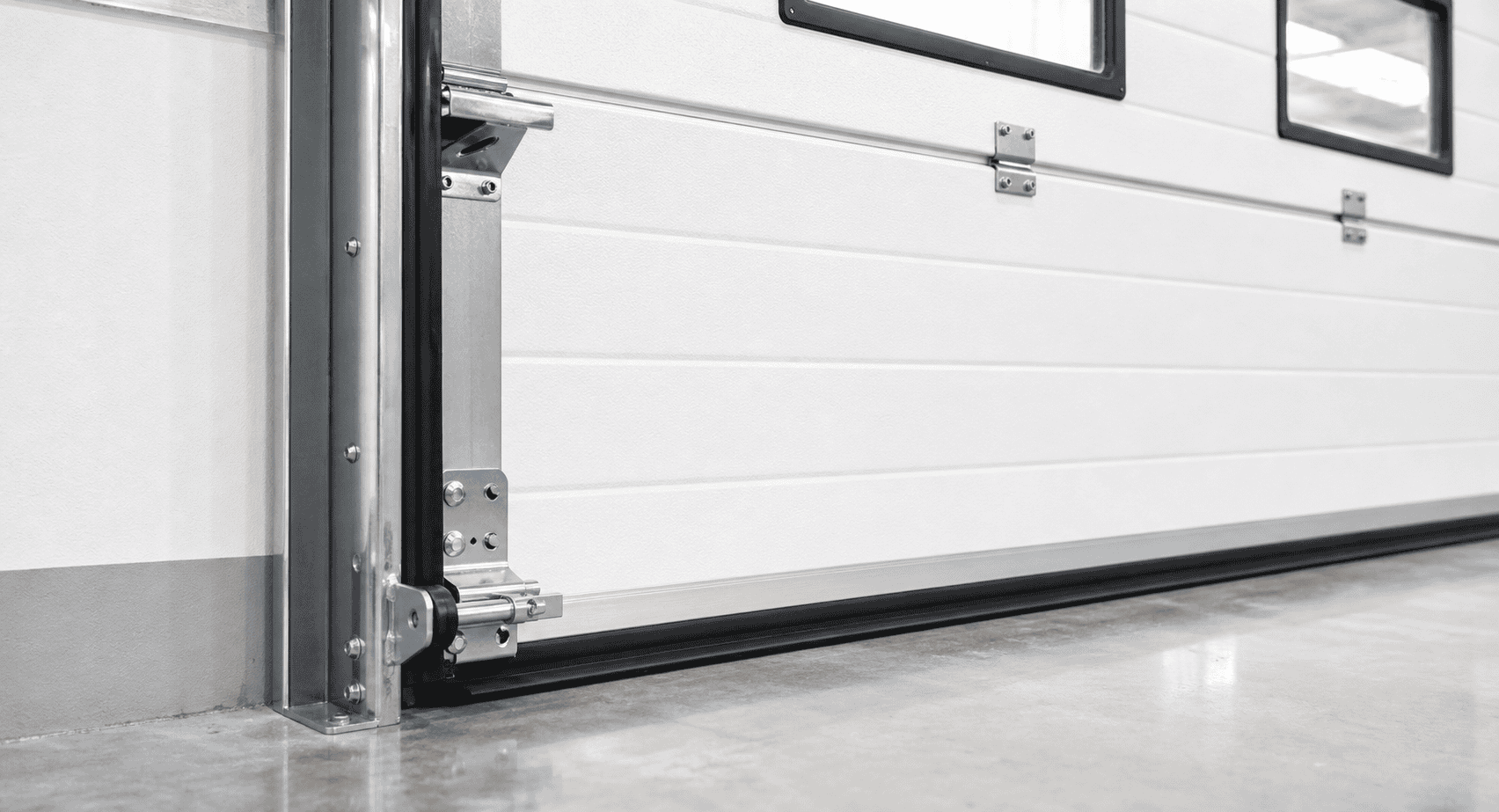 insulated sectional overhead door sealing system with side and bottom seals