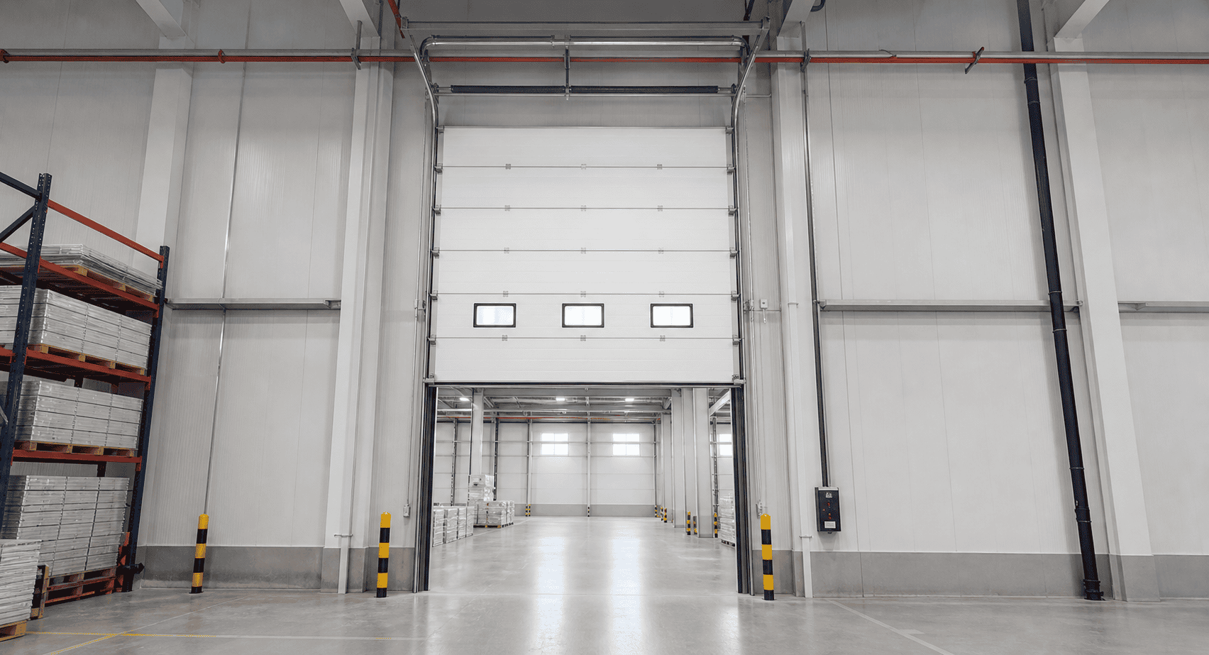 high lift sectional overhead door improving industrial entrance clearance