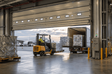 Fast rolling industrial door at airport cargo terminal for logistics.
