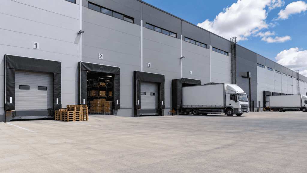 Modern logistics facility with industrial sectional doors supporting efficient loading dock operations